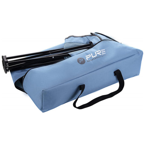 A blue carrying bag with a black handle contains a folded structure possibly for outdoor use suggesting it is designed for portability and convenience in various settings.