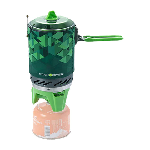 A camp stove sits atop a propane canister with a geometric green and black design on the stove body featuring a lid and foldable green handles in a neutral background.