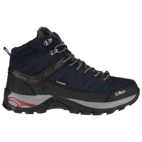 A waterproof hiking boot with a high ankle design features dark blue suede and mesh materials with protective elements and a textured outsole for traction on varied terrains.