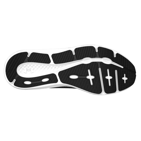 A black and white athletic shoe sole displays a patterned grip design with various textures and shapes indicating traction features suitable for physical activity in outdoor or gym settings.