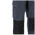 Grey work pants with a black fabric lower section feature multiple pockets and visible stitching patterns, suitable for practical tasks in industrial or construction environments.