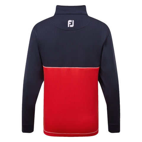 A long-sleeved pullover has a navy blue upper section and a vibrant red lower section featuring contrasting stitching and a high collar with a logo at the back.