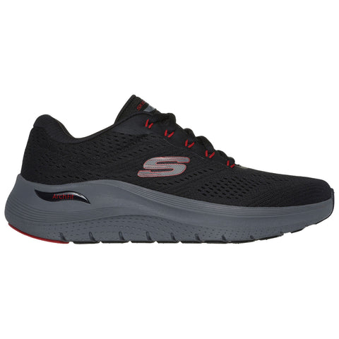 A black athletic shoe with a mesh upper features red accents and a grey sole. It is designed for comfort and support during physical activities, positioned on a neutral background.