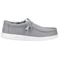 A gray slip-on shoe with a smooth upper surface features a white speckled sole and a patterned inner lining while displaying a relaxed casual style suitable for various environments.