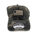 A camouflage cap features a patch with a four-leaf clover and flag design on the front and a circular label stating "Black Clover Live Lucky" on the brim.