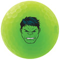 A bright green golf ball features an angry cartoon face with prominent facial features and dark hair displayed on its surface in a playful design suitable for children.