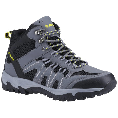 A gray and black hiking boot features a high ankle design and rugged sole providing support and traction for outdoor activities in a natural environment.