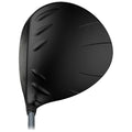 A black golf driver head is displayed from a low angle focusing on its aerodynamic design with textured grooves indicating a modern performance context typically found in a golf course setting.