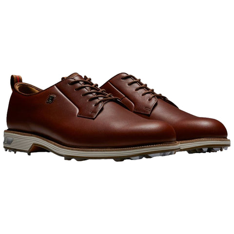 Brown leather golf shoes are displayed side by side showcasing a sleek design with lace-up detail offering a combination of style and functionality suitable for golfing activities