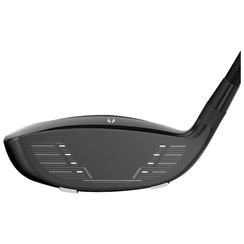 A golf club head is shown angled upwards displaying a sleek black surface with white alignment markings along the face suggesting designed use for improved ball striking in a golfing environment.