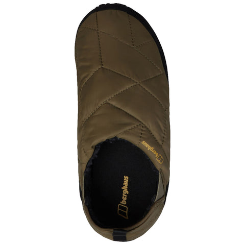 A dark green quilted slipper is positioned upright, showcasing its soft exterior and black sole, indicating comfort for indoor wear, designed for relaxation. The brand name Berghaus is visible inside.