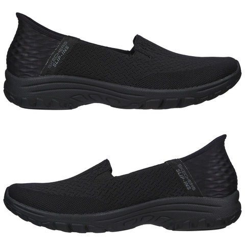 Black slip-on shoes are displayed with a textured fabric upper and a cushioned sole. They appear to be designed for comfort and casual wear. The shoes are shown from both sides.