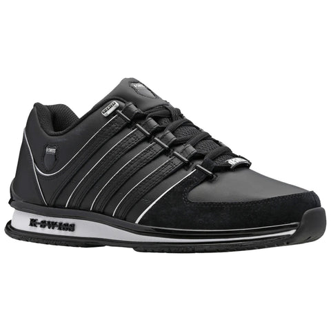 A black athletic shoe with a sleek design features three prominent stripes on the side and a cushioned sole intended for performance in sports or casual wear.