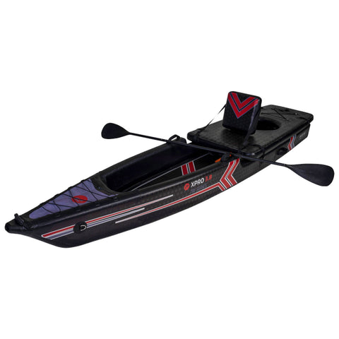 A black kayak with red and white accents rests upright featuring a padded seat and two paddles positioned on either side set against a plain background.