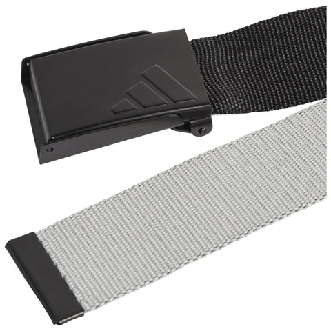 A black and gray woven belt with a sturdy rectangular buckle displaying a logo is positioned horizontally with one end folded over the other in a neutral setting.