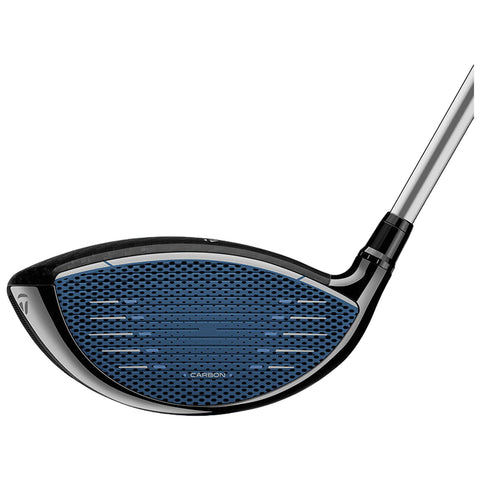 A golf driver club head is displayed featuring a blue textured face with grooves designed for striking a golf ball effectively surrounded by a sleek black and silver design.