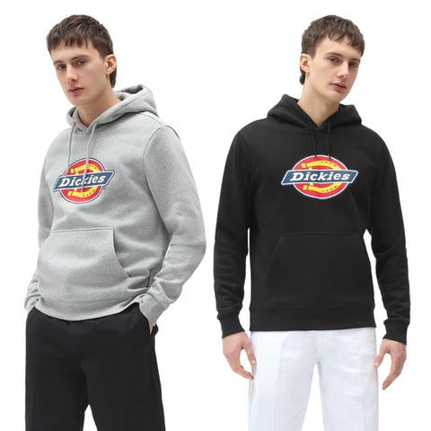 Two young men stand next to each other wearing hooded sweatshirts one grey and one black both with a circular logo labeled Dickies visible on the front