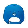 A blue cap with a white logo is displayed facing away the adjustable strap is visible at the back suggesting it can be worn comfortably in casual or sports settings.