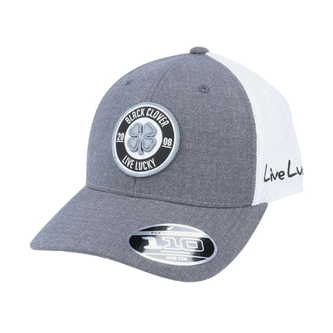 A gray baseball cap features a round logo with a four-leaf clover and the text Black Clover Live Lucky 2008 on the front with white mesh panels on the sides.