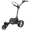 A golf trolley is positioned upright featuring three wheels and a curved handle it is designed for transporting golf clubs and gear on a course.