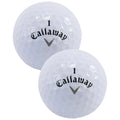 Two white golf balls with a textured surface are positioned closely together both displaying the brand name Callaway and the number one prominently on their sides in black lettering.