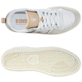 White and beige athletic shoes are displayed from above and below showing laces and textured sole emphasizing a casual style suitable for various activities or sports. The brand K-Swiss is visible inside.