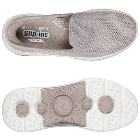 A light beige slip-on shoe with a breathable mesh upper and a white sole rests flat. The interior label reads Skechers Slip-ins Arch Fit while the sole features circular and textured designs.