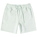 Light green shorts designed for comfort feature an elastic waistband with drawstrings and two side pockets displayed against a plain white background.