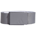 A gray fabric belt with a square metal clasp is displayed laying flat the clasp features an embossed three-stripe logo indicating a sports brand associated with athletic wear.