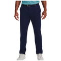 Navy blue golf chinos are worn by a standing person whose hands are relaxed at their sides. The outfit is paired with a light blue shirt and white sneakers, creating a neutral and casual ensemble suitable for the golf course.