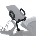 A smartphone holder is securely mounted on a flexible arm above a motorcycle dashboard allowing easy access to the phone while riding in a dynamic outdoor environment.