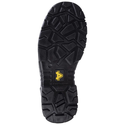 A black rubber shoe sole featuring a rugged tread pattern with multiple geometric shapes and a yellow logo at the center is shown against a plain background.