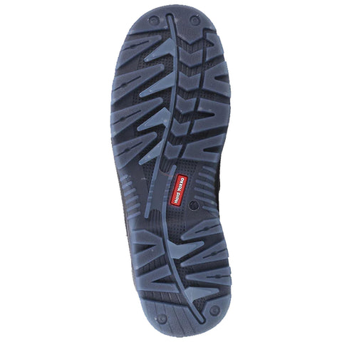 A black shoe sole features a textured pattern for traction and grip resting on a flat surface with a red logo indicating the brand and style of the shoe.