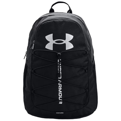 A black backpack features a prominent white Under Armour logo on the front and a bungee cord system for additional storage or securing items. It has padded shoulder straps for comfort.