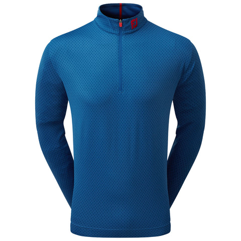 A blue long-sleeve pullover with a high collar features a quarter zip and a textured pattern throughout the fabric, designed for casual or athletic wear.