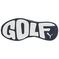 A black and white shoe sole displays the word GOLF prominently in large letters with a textured surface suggesting grip and traction suitable for sports activities in a casual setting.