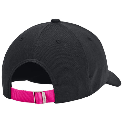 A black baseball cap is positioned with its back facing the viewer showcasing a bright pink adjustable strap and a rounded crown revealing ventilation eyelets