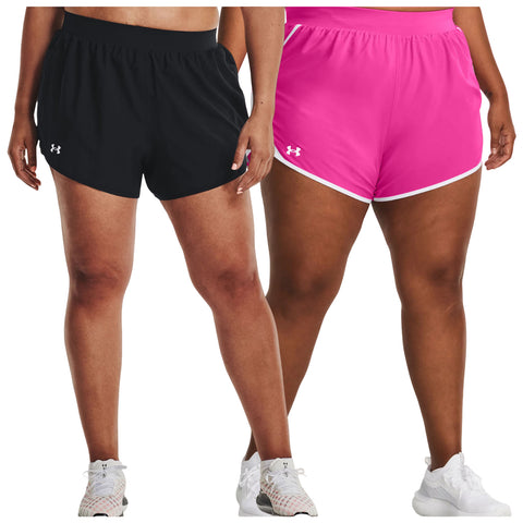 Two pairs of athletic shorts are displayed side by side on two individuals. The left pair is black and the right pair is pink with white detailing. Both wear athletic shoes.