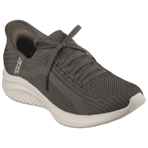 A dark green athletic shoe sits upright featuring a textured mesh upper lacing system and a thick white sole designed for comfort and performance in a casual environment.