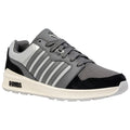 A grey athletic shoe features a mesh and suede design with prominent striped detailing and a white sole, positioned against a plain background, showcasing its stylish and functional appearance.