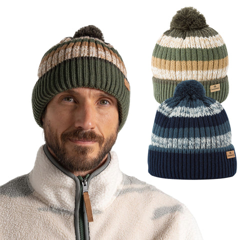 A man with a beard wears a green knitted hat and a fleece jacket. Two additional multicolored knitted hats are displayed beside him, featuring various striped patterns and a pom-pom on top.