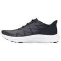 A black athletic shoe with a textured upper and white sole rests on a flat surface highlighting its sleek design and suitable for running or casual wear.