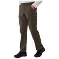 Cargo pants are worn by a person standing with one hand in a pocket showcasing their practical design and utility while wearing black shoes in a neutral background.