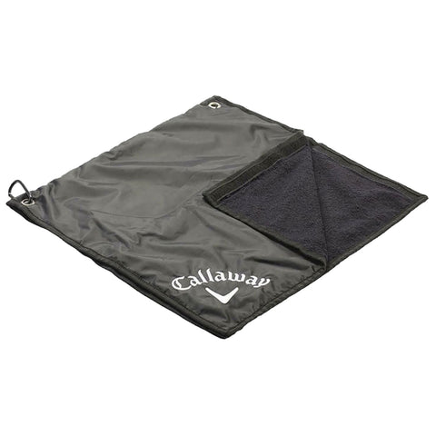 A dark green golf towel lies flat with one side featuring a soft black texture while the opposite side displays a logo of Callaway stitched in white at the bottom.