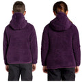 Two individuals are wearing similar purple fleece hoodies with hoods up standing side by side facing away from the viewer in a neutral setting with no distinct background features.