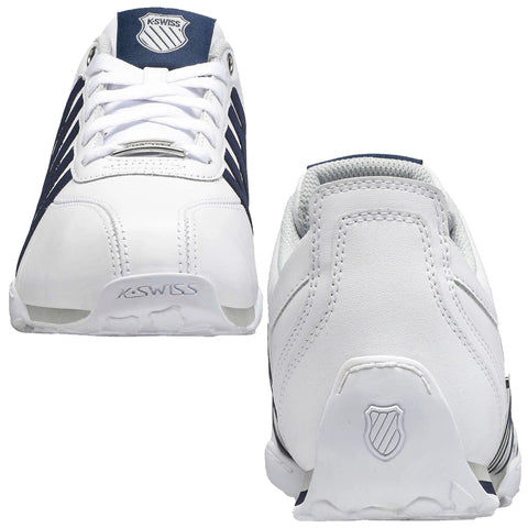 Two athletic shoes are displayed side by side with a white and navy color scheme showcasing a sleek design featuring laces and a textured sole emphasizing their athletic purpose