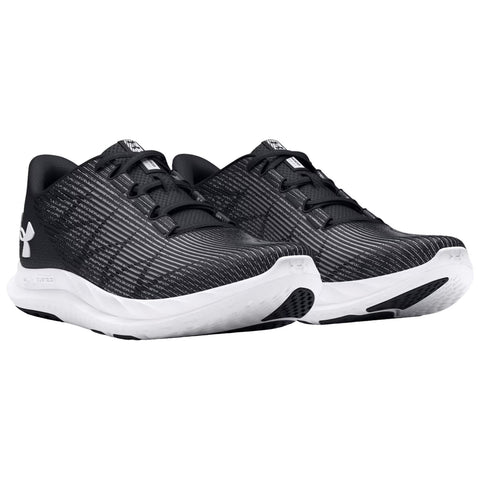 Black athletic shoes are positioned side by side with a textured design and white soles showcasing their sporty appearance suitable for running or training in various environments.