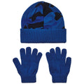 A blue knit beanie and a pair of blue gloves are arranged neatly on a surface showcasing a camo pattern on the beanie with ribbed cuffs on both items