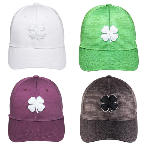 Four baseball caps are displayed in a grid pattern featuring a shamrock emblem on each front The colors include white green purple and black with varying textures