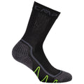 A black sock with textured grey sections is positioned upright showcasing its design features including branding and green accents suggesting it's intended for outdoor or athletic activities.